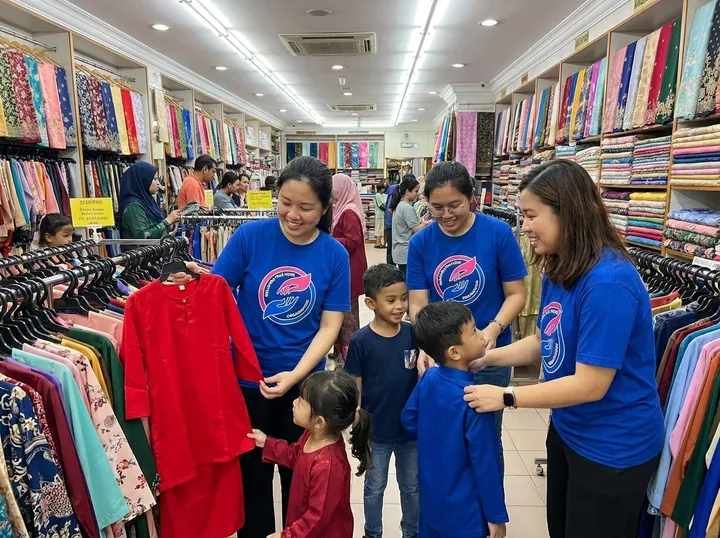 Choosing festive clothes with volunteer support.